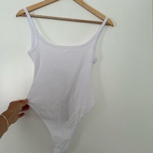 All things golden THE LUXE RIB LOW BACK BODYSUIT - WHITE, never worn. Size S